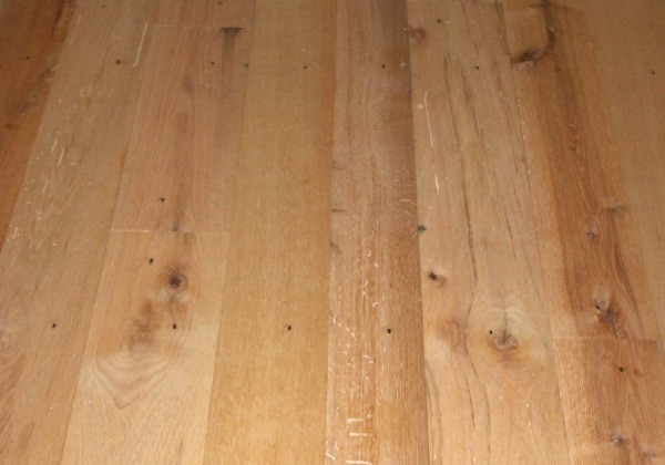 red Oak flooring, remilled from log house and barn timbers.